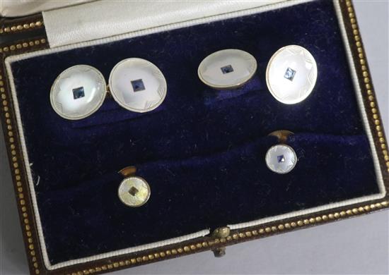 A early 20th century cased 18ct & 9ct gold, mother of pearl and gem set four piece dress stud set.